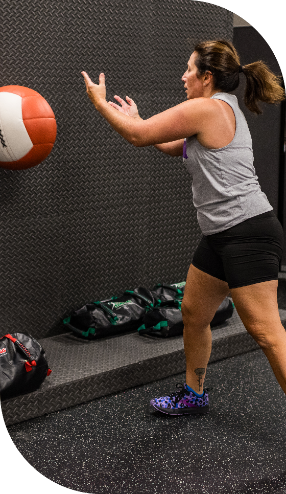 Woman working out with medicine ball